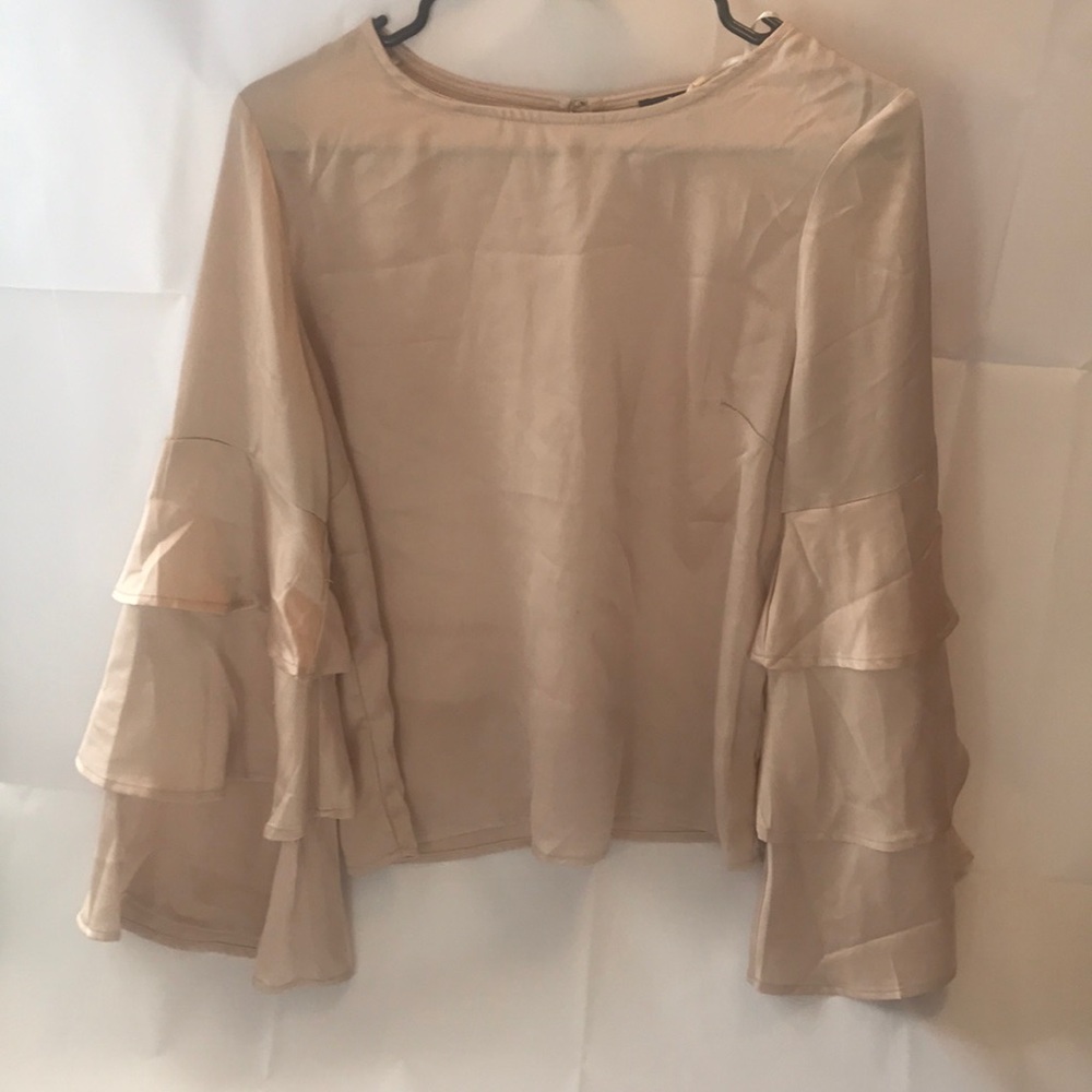 Feel like a lady in this cream blouse